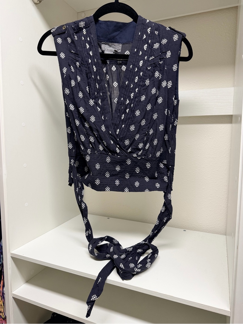 Anthropologie Navy Sleeveless Wrap Top with White Geometric Print Size XS